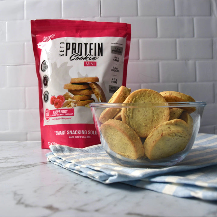 Justine's keto mini raspberry white choc chip protein cookies in a bowl