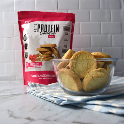 Justine's keto mini raspberry white choc chip protein cookies in a bowl